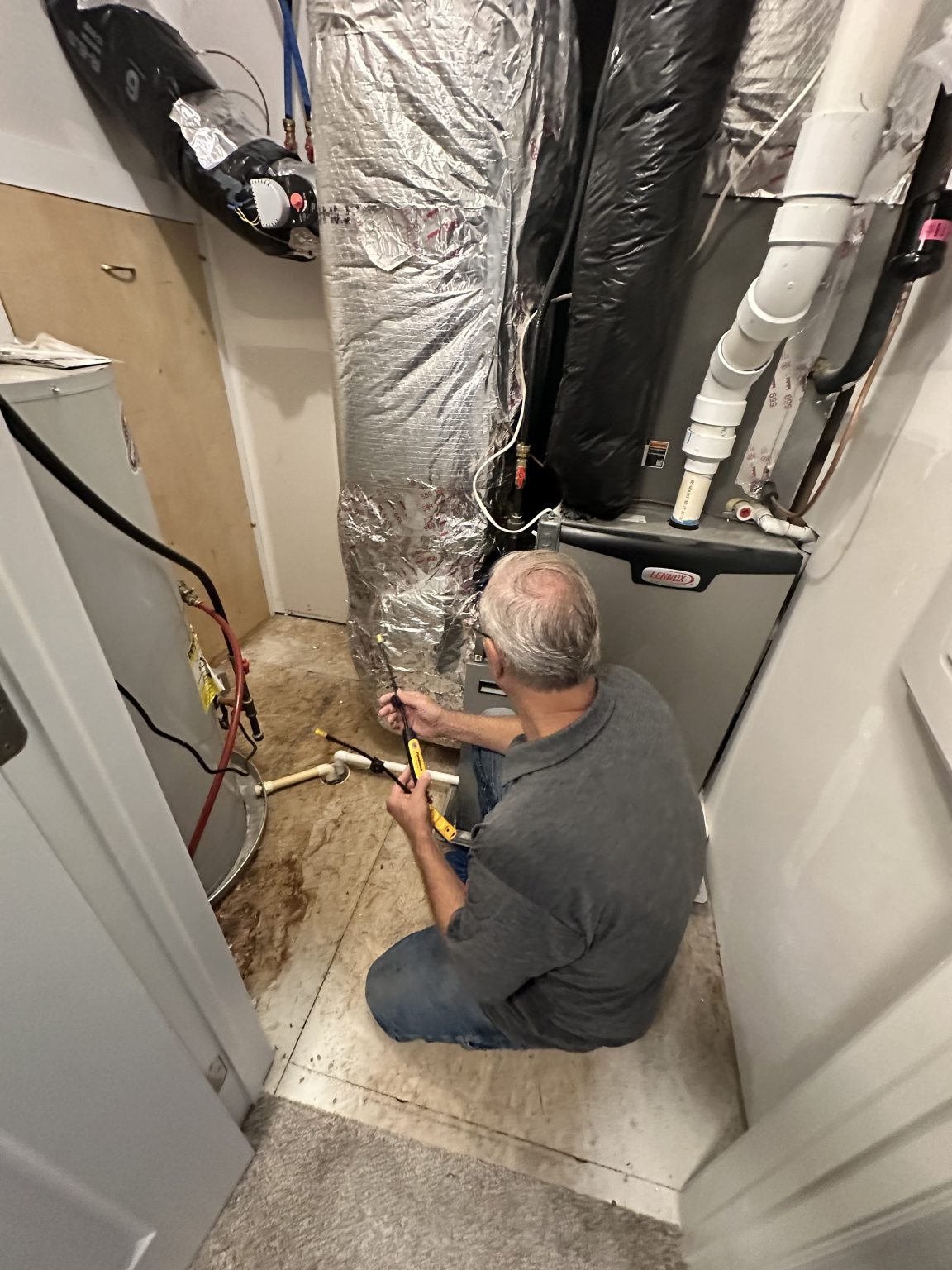 Homelio technician running a diagnostic at the furnace