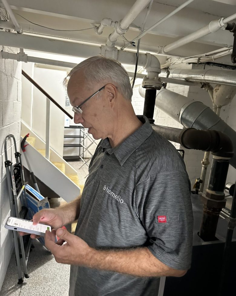 Dave, Homelio's technician, recording a home system during a Baseline visit